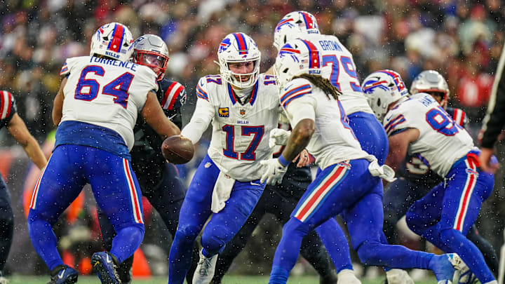 Dec 14, 2025; Foxborough, Massachusetts, USA; Buffalo Bills quarterback Josh Allen (17) hands off the ball against the New England Patriots in the first quarter at Gillette Stadium. Dec 14, 2025; Foxborough, Massachusetts, USA; Buffalo Bills quarterback Josh Allen (17) hands off the ball against the New England Patriots in the first quarter at Gillette Stadium.