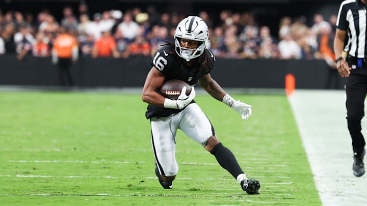 Sep 28, 2025; Paradise, Nevada, USA; Las Vegas Raiders wide receiver Jakobi Meyers (16) runs the ball during the second half against the Chicago Bears at Allegiant Stadium. Mandatory Credit: Kiyoshi Mio-Imagn Images