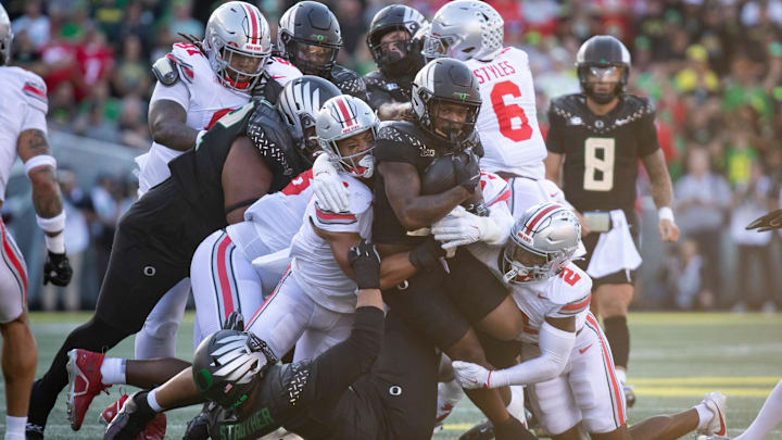 Oregon Ducks running back Jordan James runs up the middle vs the Ohio State Buckeyes Oregon Ducks running back Jordan James runs up the middle vs the Ohio State Buckeyes