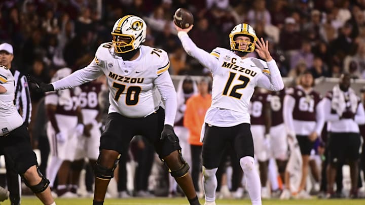 Nov 23, 2024; Starkville, Mississippi, USA; Missouri Tigers quarterback Brady Cook (12) throws against the Mississippi State Bulldogs during the third quarter at Davis Wade Stadium at Scott Field. Mandatory Credit: Matt Bush-Imagn Images