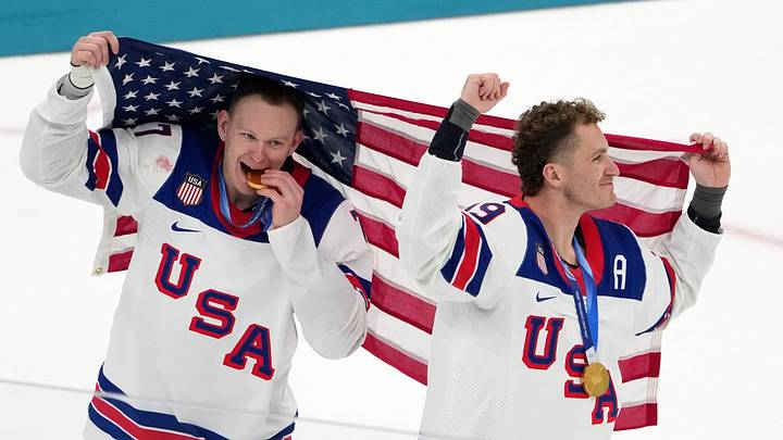 Feb 22, 2026; Milan, Italy; Brady Tkachuk and Matthew Tkachuk of the United States celebrate after winning the men's ice hockey gold medal game during the Milano Cortina 2026 Olympic Winter Games at Milano Santagiulia Ice Hockey Arena. Mandatory Credit: James Lang-Imagn Images
