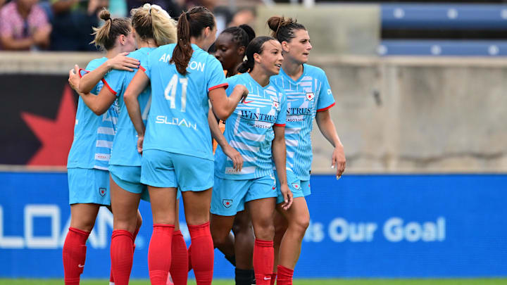 Jul 6, 2024; Bridgeview, Illinois, USA; Chicago Red Stars forward Mallory Swanson (second from right) celebrates with teammates after scoring a goal against the Houston Dash during the first half at SeatGeek Stadium. Mandatory Credit: Daniel Bartel-USA TODAY Sports