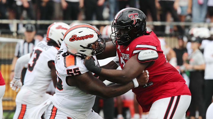 Sep 13, 2025; Lubbock, Texas, USA;   Oregon State Beavers offensive lineman Van Wells (55) blocks Texas Tech Red Raiders defensive guard Lee Hunter (2) in the first half at Jones AT&T Stadium. Mandatory Credit: Michael C. Johnson-Imagn Images