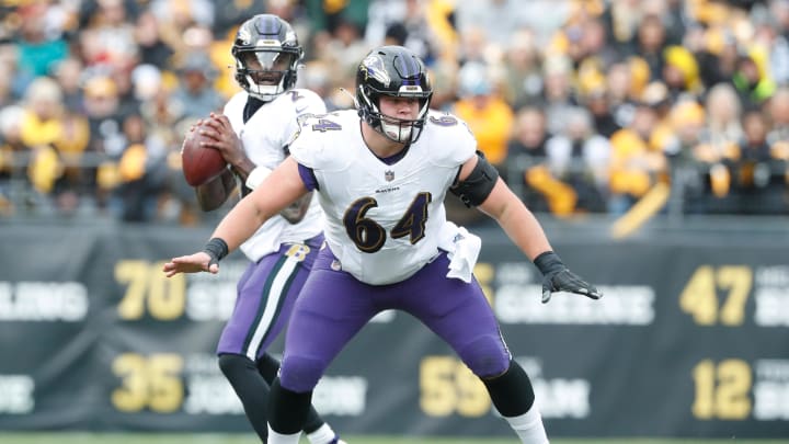 Dec 11, 2022; Pittsburgh, Pennsylvania, USA;  Baltimore Ravens center Tyler Linderbaum (64) in pass protection at the line of scrimmage against the Pittsburgh Steelers during the second quarter at Acrisure Stadium. Mandatory Credit: Charles LeClaire-USA TODAY Sports