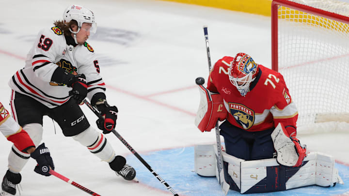 Oct 7, 2025; Sunrise, Florida, USA; Florida Panthers goaltender Sergei Bobrovsky (72) makes a save against Chicago Blackhawks left wing Tyler Bertuzzi (59) during the third period at Amerant Bank Arena. Mandatory Credit: Sam Navarro-Imagn Images