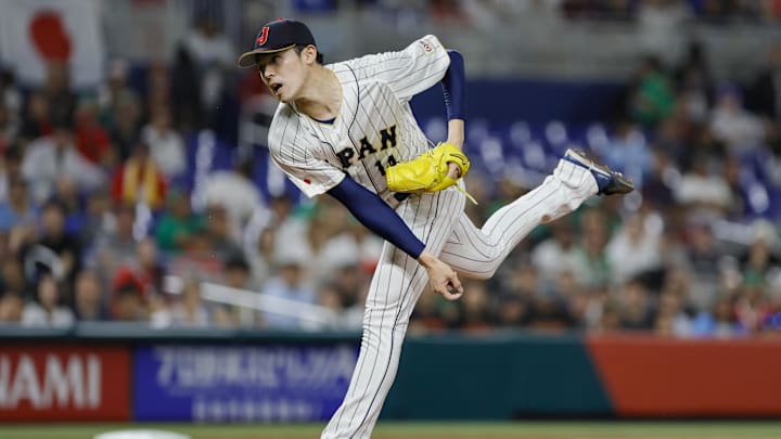 Mar 20, 2023; Miami, Florida, USA; Japan starting pitcher Roki Sasaki (14) delivers a pitch during the first inning against Mexico at LoanDepot Park. Mar 20, 2023; Miami, Florida, USA; Japan starting pitcher Roki Sasaki (14) delivers a pitch during the first inning against Mexico at LoanDepot Park.