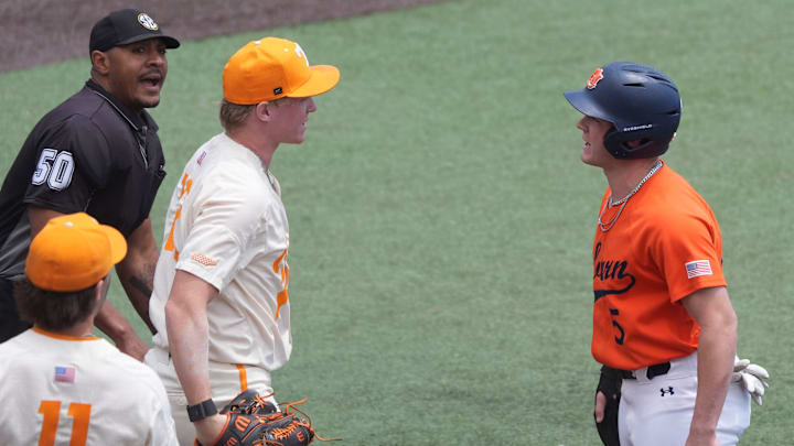Tennessee's Liam Doyle (12) and Auburn's Bristol Carter (5) exchange words after Carter was tagged out at home plate during an NCAA baseball game on May 4, 2025, in Knoxville, Tenn.