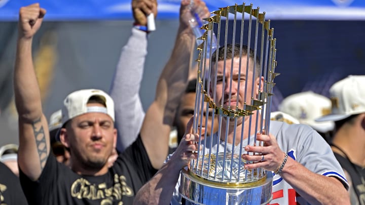 Nov 1, 2024; Los Angeles, CA, USA; Los Angeles Dodgers catcher Austin Barnes (15) cheers as starting pitcher Walker Buehler (21) holds the World Series trophy during the team celebration at Dodger Stadium. Mandatory Credit: Jayne Kamin-Oncea-Imagn Images Nov 1, 2024; Los Angeles, CA, USA; Los Angeles Dodgers catcher Austin Barnes (15) cheers as starting pitcher Walker Buehler (21) holds the World Series trophy during the team celebration at Dodger Stadium. Mandatory Credit: Jayne Kamin-Oncea-Imagn Images