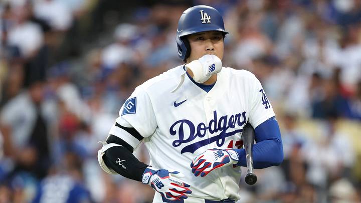 Sep 7, 2026; Los Angeles, California, USA; Los Angeles Dodgers designated hitter Shohei Ohtani (17) jogs to the dugout with a piece of protective gear in his mouth after striking out against Cincinnati Reds starting pitcher Chase Burns (not pictured) during the third inning at Dodger Stadium. Mandatory Credit: Kiyoshi Mio-Imagn Images Sep 7, 2026; Los Angeles, California, USA; Los Angeles Dodgers designated hitter Shohei Ohtani (17) jogs to the dugout with a piece of protective gear in his mouth after striking out against Cincinnati Reds starting pitcher Chase Burns (not pictured) during the third inning at Dodger Stadium. Mandatory Credit: Kiyoshi Mio-Imagn Images
