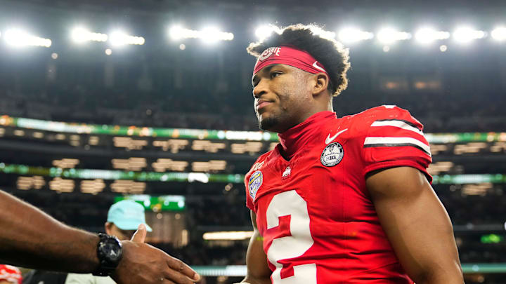 Ohio State Buckeyes defensive back Caleb Downs (2) leaves the field following the Cotton Bowl at AT&T Stadium in Arlington, Texas for the College Football Playoff quarterfinal game against the Miami Hurricanes on Dec. 31, 2025. Ohio State lost 24-14. Ohio State Buckeyes defensive back Caleb Downs (2) leaves the field following the Cotton Bowl at AT&T Stadium in Arlington, Texas for the College Football Playoff quarterfinal game against the Miami Hurricanes on Dec. 31, 2025. Ohio State lost 24-14.
