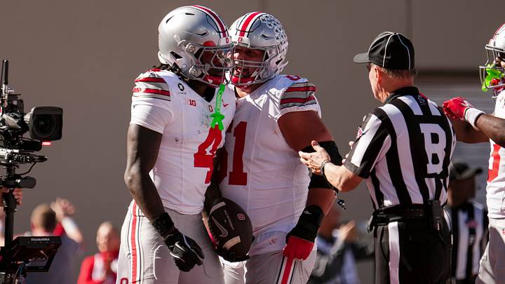 Ohio State wide receiver Jeremiah Smith (4) celebrates a touchdown with offensive lineman Luke Montgomery (51) during their game against Indiana at Memorial Stadium. Ohio State wide receiver Jeremiah Smith (4) celebrates a touchdown with offensive lineman Luke Montgomery (51) during their game against Indiana at Memorial Stadium.
