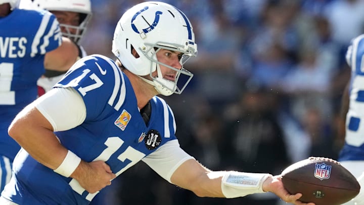 Indianapolis Colts quarterback Daniel Jones (17) hands off the ball during a game against the Arizona Cardinals on Sunday, Oct. 12, 2025, at Lucas Oil Stadium in Indianapolis. The Colts defeated the Cardinals 31-27.
