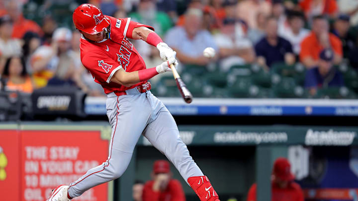 Sep 1, 2025; Houston, Texas, USA; Los Angeles Angels pinch hitter Logan O'Hoppe (14) hits a single against the Houston Astros during the eighth inning at Daikin Park. Mandatory Credit: Erik Williams-Imagn Images
