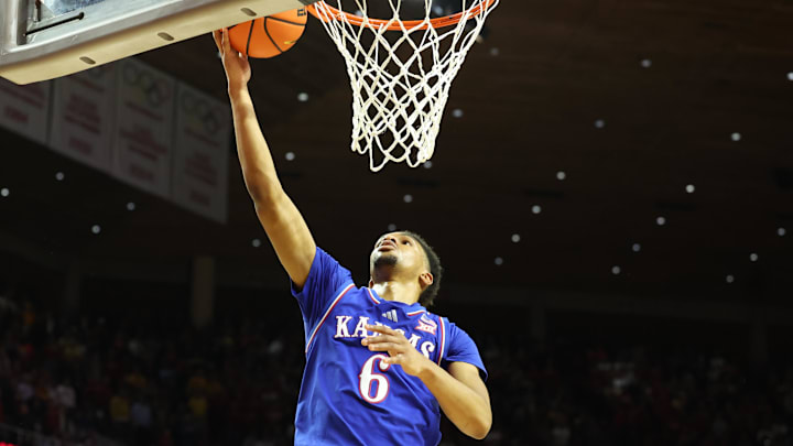 Jan 15, 2025; Ames, Iowa, USA;  Kansas Jayhawks guard Rylan Griffen (6) scores against the Iowa State Cyclones during the second half at James H. Hilton Coliseum. Mandatory Credit: Reese Strickland-Imagn Images