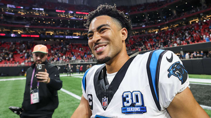 Jan 5, 2025; Atlanta, Georgia, USA; Carolina Panthers quarterback Bryce Young (9) celebrates after a victory over the Atlanta Falcons in overtime at Mercedes-Benz Stadium. Mandatory Credit: Brett Davis-Imagn Images