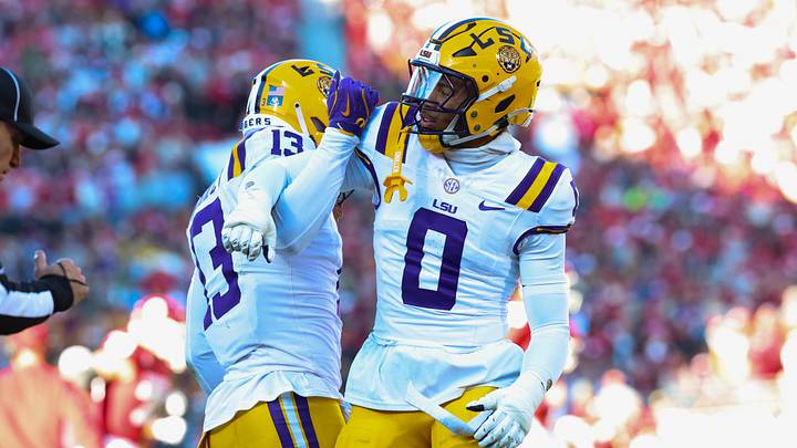LSU Tigers defensive back A.J. Haulcy (13) and Louisiana State Tigers safety Tamarcus Cooley (0) react during the first half against the Oklahoma Sooners at Gaylord Family-Oklahoma Memorial Stadium. LSU Tigers defensive back A.J. Haulcy (13) and Louisiana State Tigers safety Tamarcus Cooley (0) react during the first half against the Oklahoma Sooners at Gaylord Family-Oklahoma Memorial Stadium.