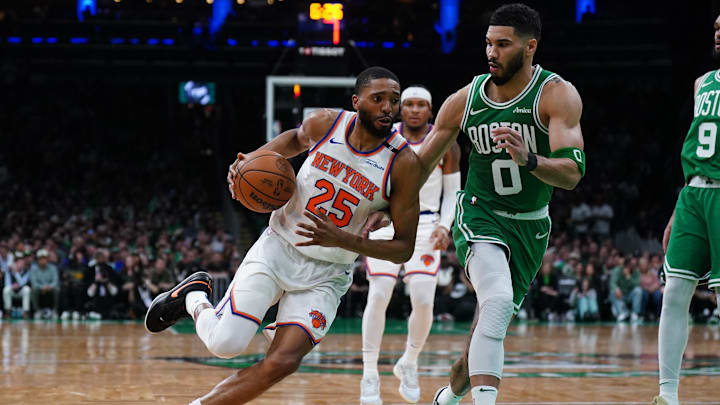 May 7, 2025; Boston, Massachusetts, USA; New York Knicks forward Mikal Bridges (25) drives the ball against Boston Celtics forward Jayson Tatum (0) in the second quarter during game two of the second round for the 2025 NBA Playoffs at TD Garden. Mandatory Credit: David Butler II-Imagn Images