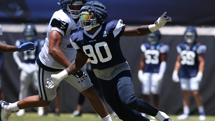 Dallas Cowboys defensive end DeMarcus Lawrence rushes during training camp.