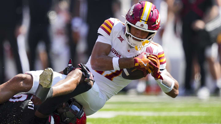 Oct 4, 2025; Cincinnati, Ohio, USA;  Iowa State Cyclones wide receiver Dominic Overby (11) makes a catch against Cincinnati Bearcats cornerback Matthew McDoom (0) in the first half at Nippert Stadium.