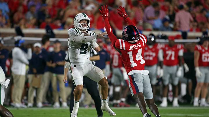 Charlotte 49ers quarterback Cole Gonzales passes the ball over Mississippi Rebels safety Edwin Joseph during the second quarter at Vaught-Hemingway Stadium. Mandatory Credit: Petre Thomas-Imagn Images Charlotte 49ers quarterback Cole Gonzales passes the ball over Mississippi Rebels safety Edwin Joseph during the second quarter at Vaught-Hemingway Stadium. Mandatory Credit: Petre Thomas-Imagn Images