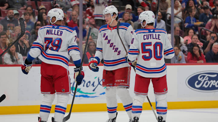 Apr 14, 2025; Sunrise, Florida, USA; New York Rangers center Matt Rempe (73) celebrates with defenseman K'Andre Miller (79) and left wing Will Cuylle (50) after scoring against the Florida Panthers during the first period at Amerant Bank Arena. Mandatory Credit: Sam Navarro-Imagn Images
