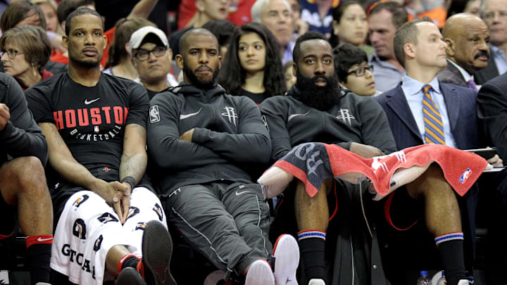 Mar 30, 2018; Houston, TX, USA; (from left to right) Houston Rockets forward Trevor Ariza (1), Houston Rockets guard Chris Paul (3) and Houston Rockets guard James Harden (13) sit on the bench during the third quarter against the Phoenix Suns at Toyota Center. Mandatory Credit: Erik Williams-USA TODAY Sports