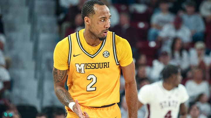 Feb 1, 2025; Starkville, Mississippi, USA; Missouri Tigers guard Tamar Bates (2) reacts after a three point basket against the Mississippi State Bulldogs during the second half at Humphrey Coliseum. Mandatory Credit: Wesley Hale-Imagn Images