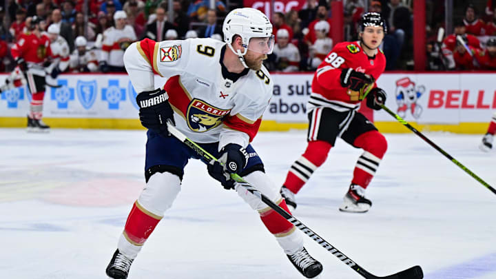 Nov 21, 2024; Chicago, Illinois, USA; Florida Panthers center Sam Bennett (9) plays the puck against the Chicago Blackhawks during the first period at the United Center. Mandatory Credit: Daniel Bartel-Imagn Images