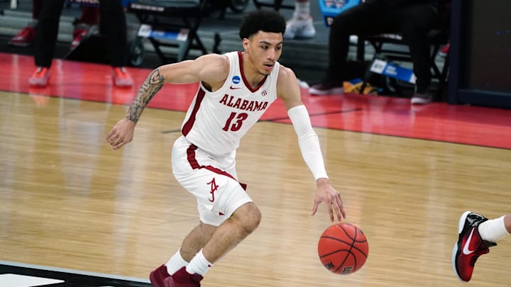 Mar 22, 2021; Indianapolis, Indiana, USA; Alabama Crimson Tide guard Jahvon Quinerly (13) drives