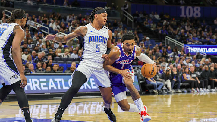 Philadelphia 76ers forward KJ Martin (1) drives past Orlando Magic forward Paolo Banchero (5) during the first quarter at Kia Center.