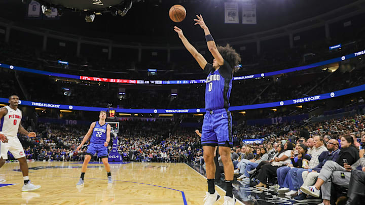 Orlando Magic guard Anthony Black (0) shoots a three point basket during the second half against the Detroit Pistons at Kia Center.