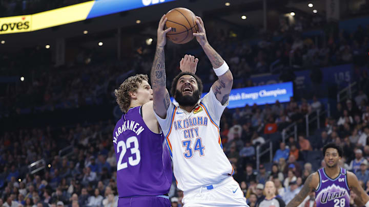 Jan 7, 2026; Oklahoma City, Oklahoma, USA; Oklahoma City Thunder guard/forward Kenrich Williams (34) goes up for a basket beside Utah Jazz forward/center Lauri Markkanen (23) during the second quarter at Paycom Center. Mandatory Credit: Alonzo Adams-Imagn Images