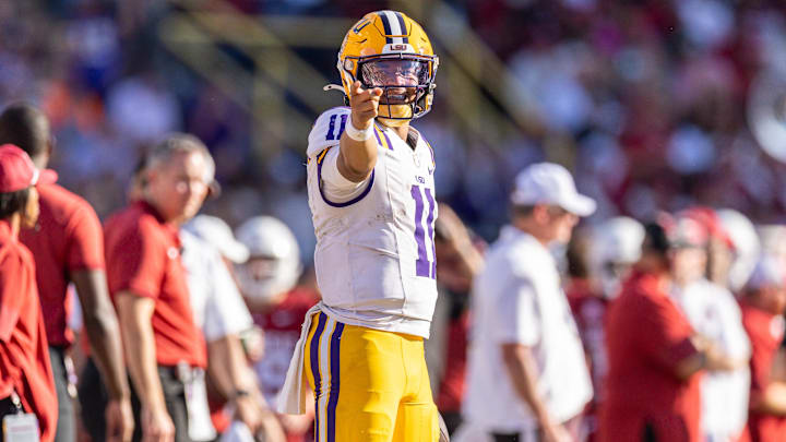 Nov 15, 2025; Baton Rouge, Louisiana, USA;  LSU Tigers quarterback Michael van Buren Jr. (11) reacts to running for a first down against the Arkansas Razorbacks during the second half at Tiger Stadium. Mandatory Credit: Stephen Lew-Imagn Images