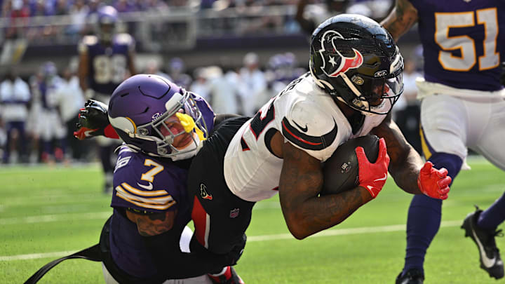 Sep 22, 2024; Minneapolis, Minnesota, USA; Houston Texans running back Cam Akers (22) runs for a touchdown as Minnesota Vikings cornerback Byron Murphy Jr. (7) attempts to make the tackle during the third quarter at U.S. Bank Stadium. Sep 22, 2024; Minneapolis, Minnesota, USA; Houston Texans running back Cam Akers (22) runs for a touchdown as Minnesota Vikings cornerback Byron Murphy Jr. (7) attempts to make the tackle during the third quarter at U.S. Bank Stadium.