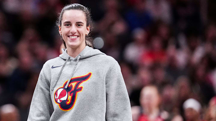 Indiana Fever Caitlin Clark (22) smiles Saturday, May 3, 2025, during a timeout at a preseason game between the Indiana Fever and the Washington Mystics at Gainbridge Fieldhouse in Indianapolis.