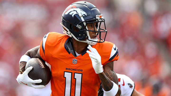 Sep 22, 2024; Tampa, Florida, USA; Denver Broncos wide receiver Josh Reynolds (11) makes a catch against the Tampa Bay Buccaneers in the first quarter at Raymond James Stadium. Mandatory Credit: Nathan Ray Seebeck-Imagn Images