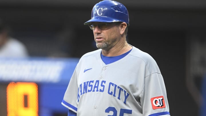 Sep 10, 2025; Cleveland, Ohio, USA; Kansas City Royals major league field coordinator, third base coach Vance Wilson (25) stands on the field in the second inning against the Cleveland Guardians at Progressive Field. Sep 10, 2025; Cleveland, Ohio, USA; Kansas City Royals major league field coordinator, third base coach Vance Wilson (25) stands on the field in the second inning against the Cleveland Guardians at Progressive Field.