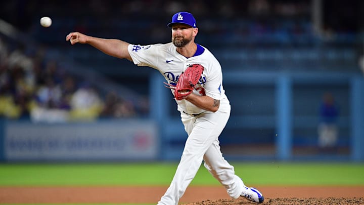 Jul 21, 2025; Los Angeles, California, USA; Los Angeles Dodgers pitcher Kirby Yates (38) throws against the Minnesota Twins during the ninth inning at Dodger Stadium. Mandatory Credit: Gary A. Vasquez-Imagn Images