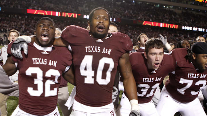 Texas A&M Aggies running back Cyrus Gray (32) and linebacker Von Miller (40) celebrate a victory against the Oklahoma Sooners in the fourth quarter at Kyle Field. Texas A&M defeated Oklahoma 33-19. 