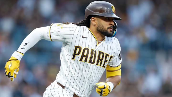 Mar 28, 2026; San Diego, California, USA; San Diego Padres right fielder Fernando Tatis Jr. (23) hits an RBI single during the third inning against the Detroit Tigers at Petco Park. 