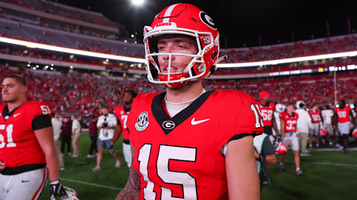 Georgia Bulldogs quarterback Carson Beck (15) walks off the field after a victory over the Mississippi State Bulldogs. Georgia Bulldogs quarterback Carson Beck (15) walks off the field after a victory over the Mississippi State Bulldogs.