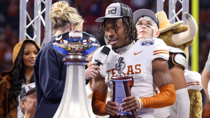 Jan 1, 2025; Atlanta, GA, USA; Texas Longhorns defensive back Jahdae Barron (7) receives the most outstanding player award after a victory over the Arizona State Sun Devils in the Peach Bowl at Mercedes-Benz Stadium. Mandatory Credit: Brett Davis-Imagn Images