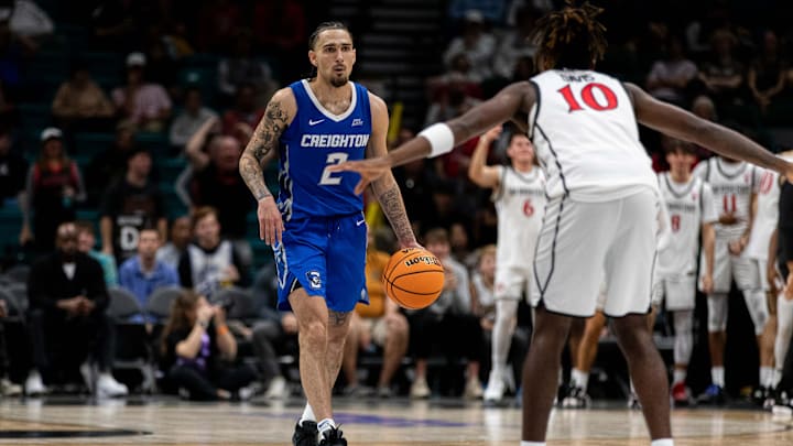 Nov 26, 2024; Las Vegas, Nevada, USA; Creighton Bluejays guard Pop Isaacs (2) dribbles toward San Diego Aztecs guard BJ Davis (10) during the second half at MGM Grand Garden Arena. Mandatory Credit: Jeffrey (Tyge) O'Donnell-Imagn Images Nov 26, 2024; Las Vegas, Nevada, USA; Creighton Bluejays guard Pop Isaacs (2) dribbles toward San Diego Aztecs guard BJ Davis (10) during the second half at MGM Grand Garden Arena. Mandatory Credit: Jeffrey (Tyge) O'Donnell-Imagn Images