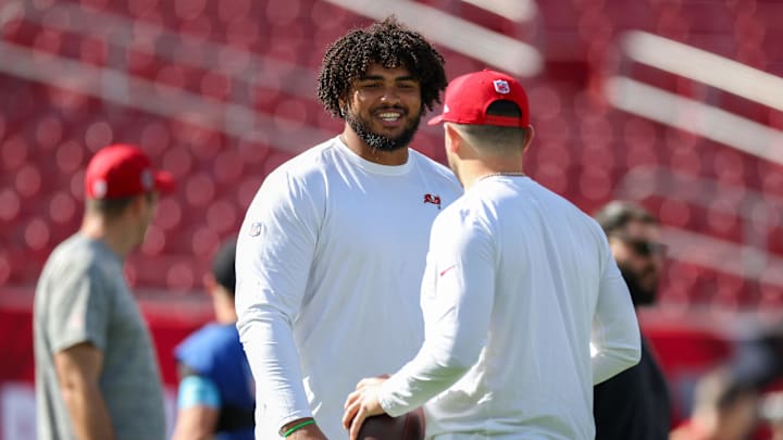 Dec 8, 2024; Tampa, Florida, USA; Tampa Bay Buccaneers offensive tackle Tristan Wirfs (78) and quarterback Baker Mayfield (6) warms up before a game against the Las Vegas Raiders at Raymond James Stadium. Mandatory Credit: Nathan Ray Seebeck-Imagn Images