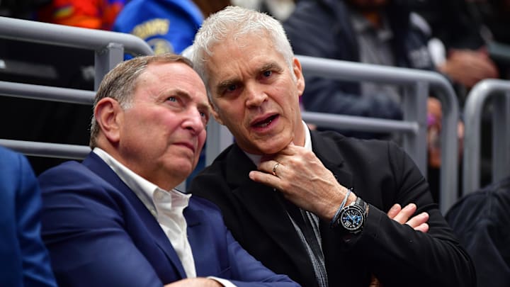 Feb 22, 2025; Los Angeles, California, USA; Los Angeles Kings executive Luc Robitaille with commissioner Gary Bettman during the first period at Crypto.com Arena. Mandatory Credit: Gary A. Vasquez-Imagn Images