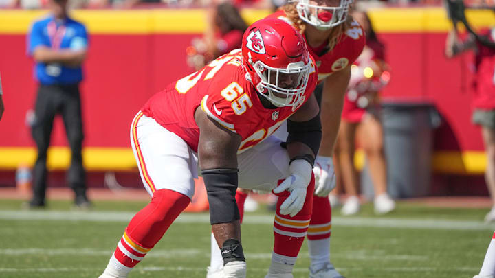 Aug 17, 2024; Kansas City, Missouri, USA; Kansas City Chiefs guard Trey Smith (65) on the line of scrimmage against the Detroit Lions during the game at GEHA Field at Arrowhead Stadium. Mandatory Credit: Denny Medley-Imagn Images