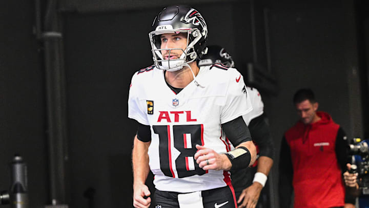 Dec 8, 2024; Minneapolis, Minnesota, USA; Atlanta Falcons quarterback Kirk Cousins (18) enters the field before the game against the Minnesota Vikings at U.S. Bank Stadium.
