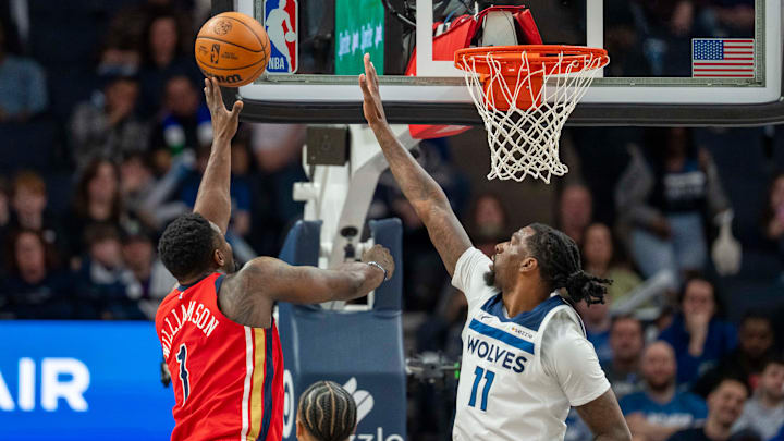 New Orleans Pelicans forward Zion Williamson shoots the ball over Minnesota Timberwolves center Naz Reid in the first half at Target Center in Minneapolis on March 19, 2025.