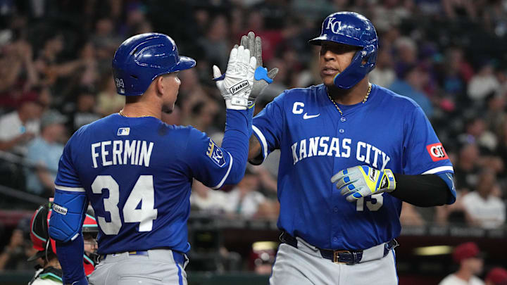 Jul 6, 2025; Phoenix, Arizona, USA; Kansas City Royals catcher Salvador Perez (13) celebrates with catcher Freddy Fermin (34) after hitting a solo home run against the Arizona Diamondbacks in the fourth inning at Chase Field. Mandatory Credit: Rick Scuteri-Imagn Images