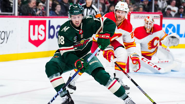 Minnesota Wild forward Sammy Walker protects the puck during the second period against the Calgary Flames at Xcel Energy Center in St. Paul, Minn., on Jan. 2, 2024. Minnesota Wild forward Sammy Walker protects the puck during the second period against the Calgary Flames at Xcel Energy Center in St. Paul, Minn., on Jan. 2, 2024.
